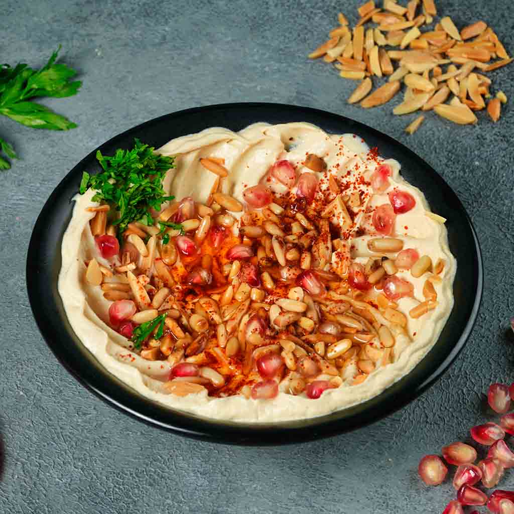 Hummus with ghee and pine nuts
