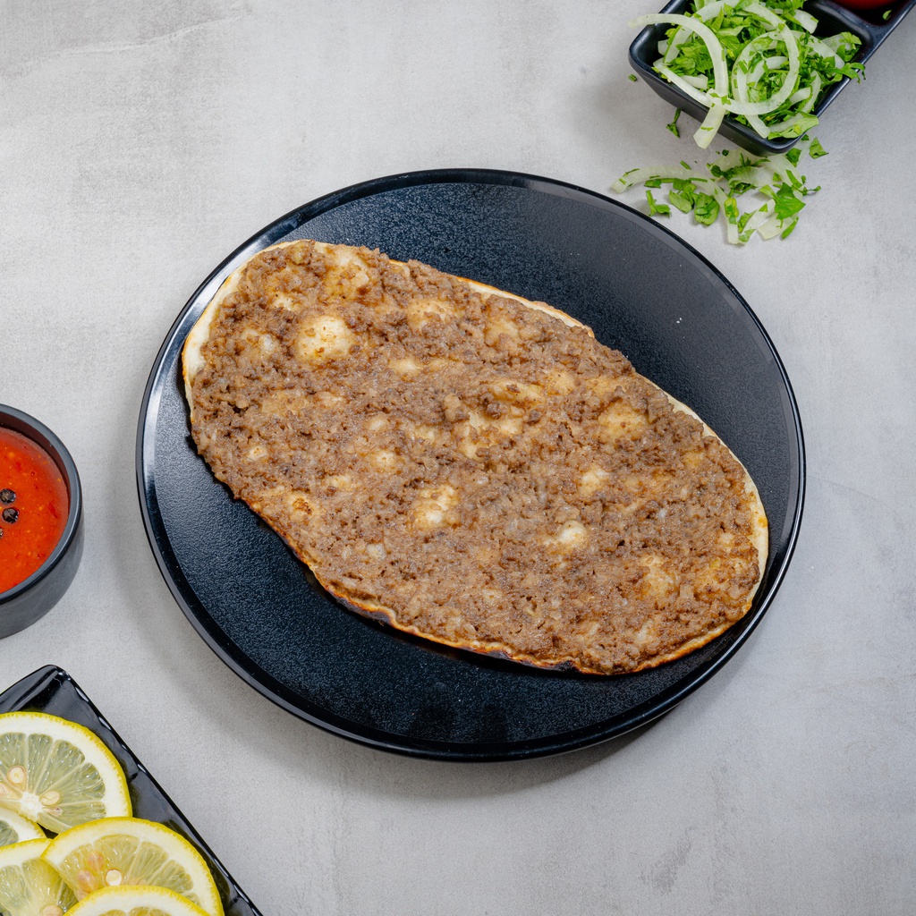 Lamb meat safiha with pomegranate molasses